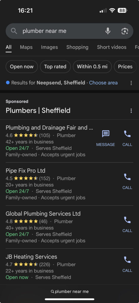 A screenshot of local service ad results for "plumber near me" searched on mobile
